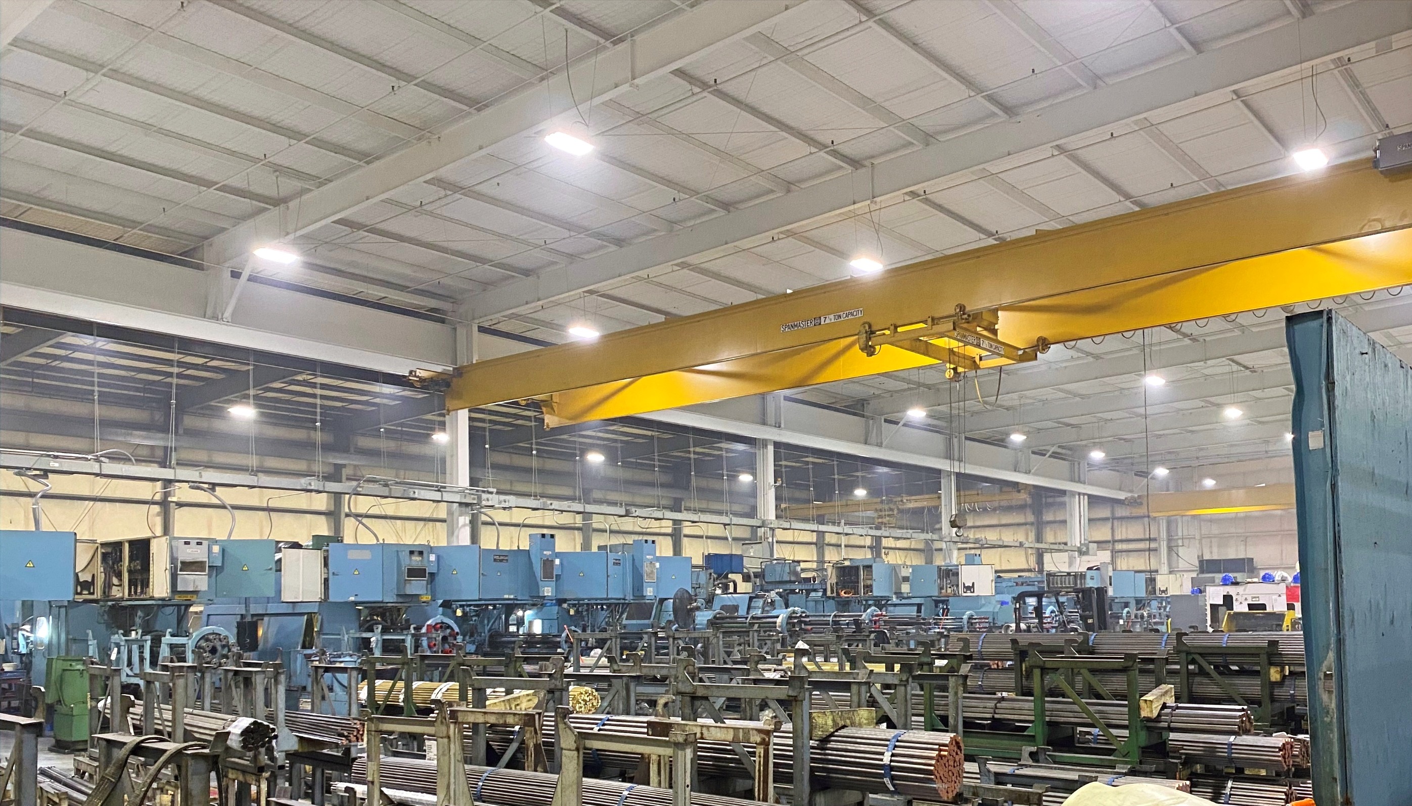 Production floor with CNC equipment and crane